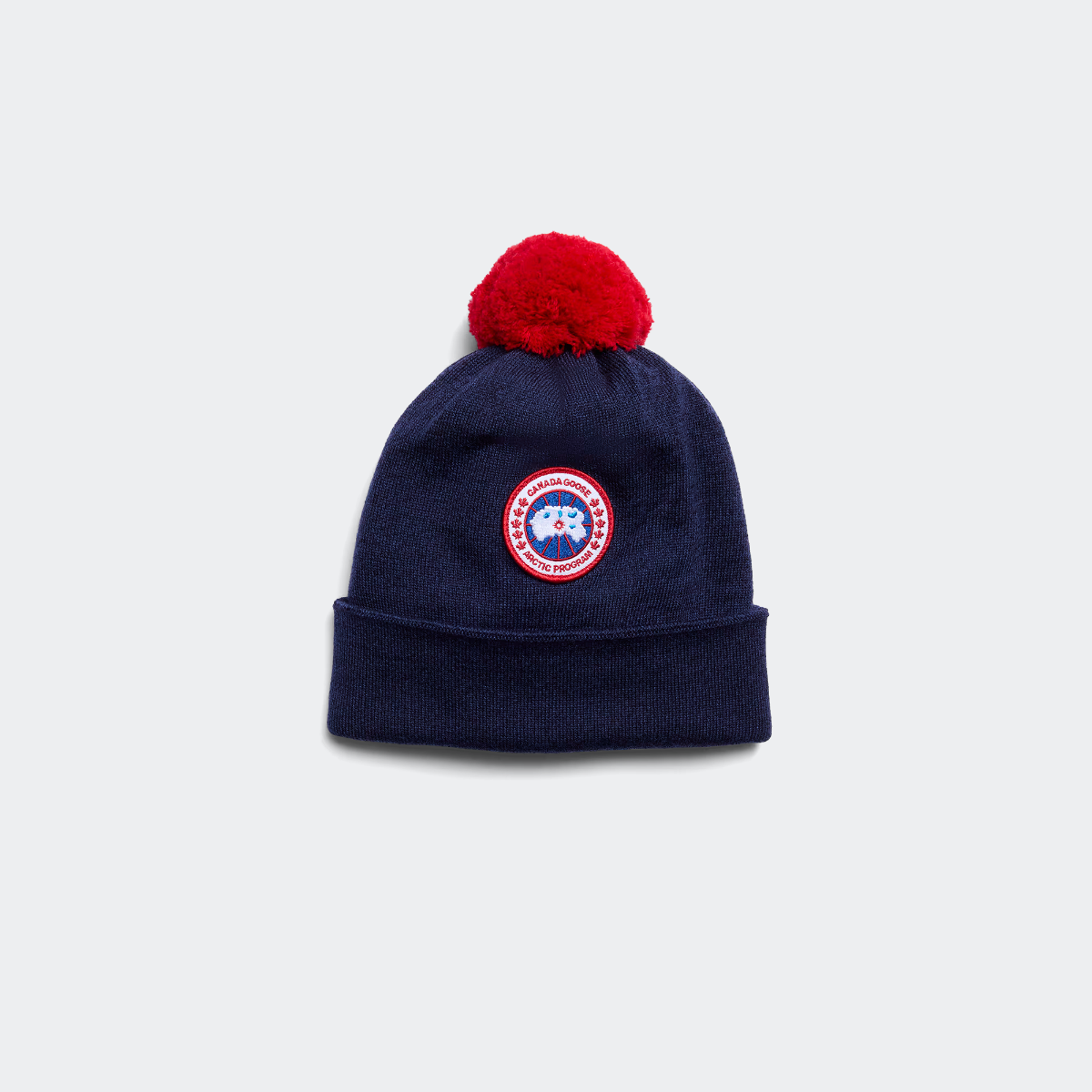 Canada Goose Bonnet pompon en laine mrinos pour enfant Enfants Navy Heather TAILLE UNIQUE 150 €